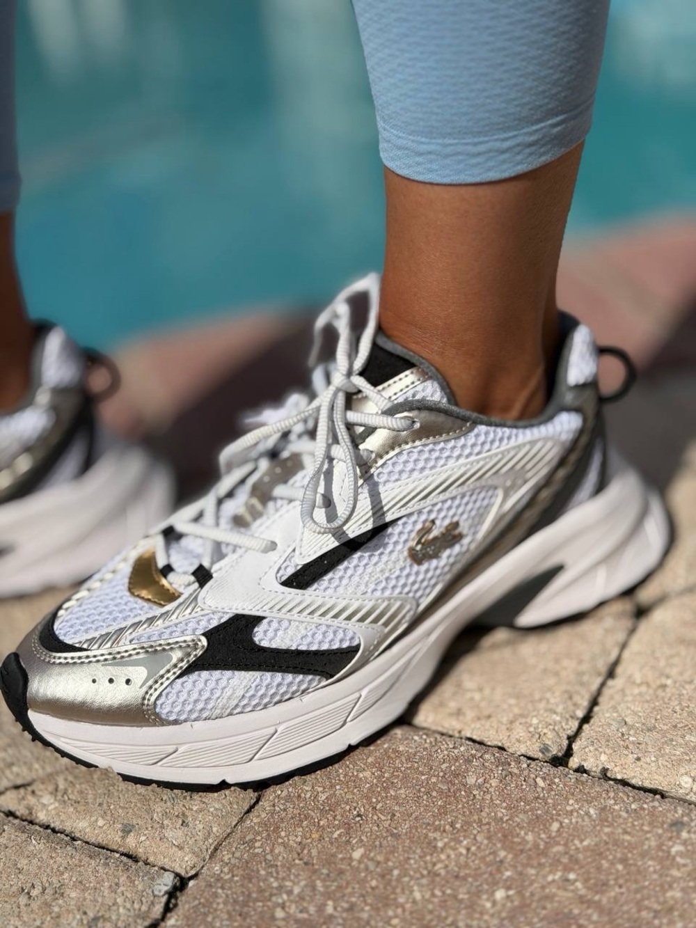 Lacoste White and Black Women's Athletic Sneakers with Metallic Detail